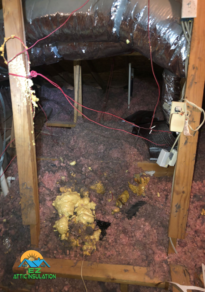 old insulation in a houston home about to be removed from ez attic insulation