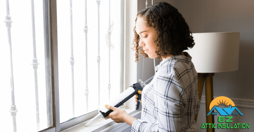 Woman sealing her window to help with energy savings in her home.