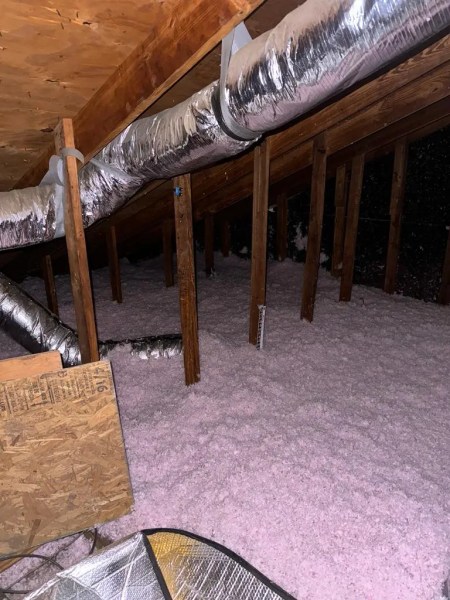 new blow in fiberglass installed in an attic