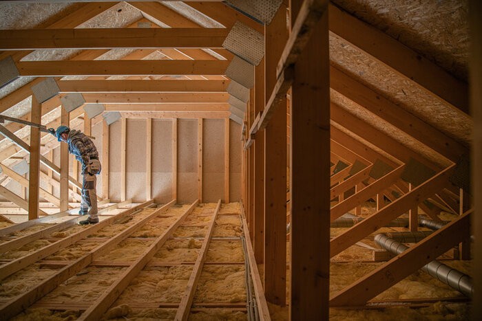 Contractor inspecting an attic before planning the work