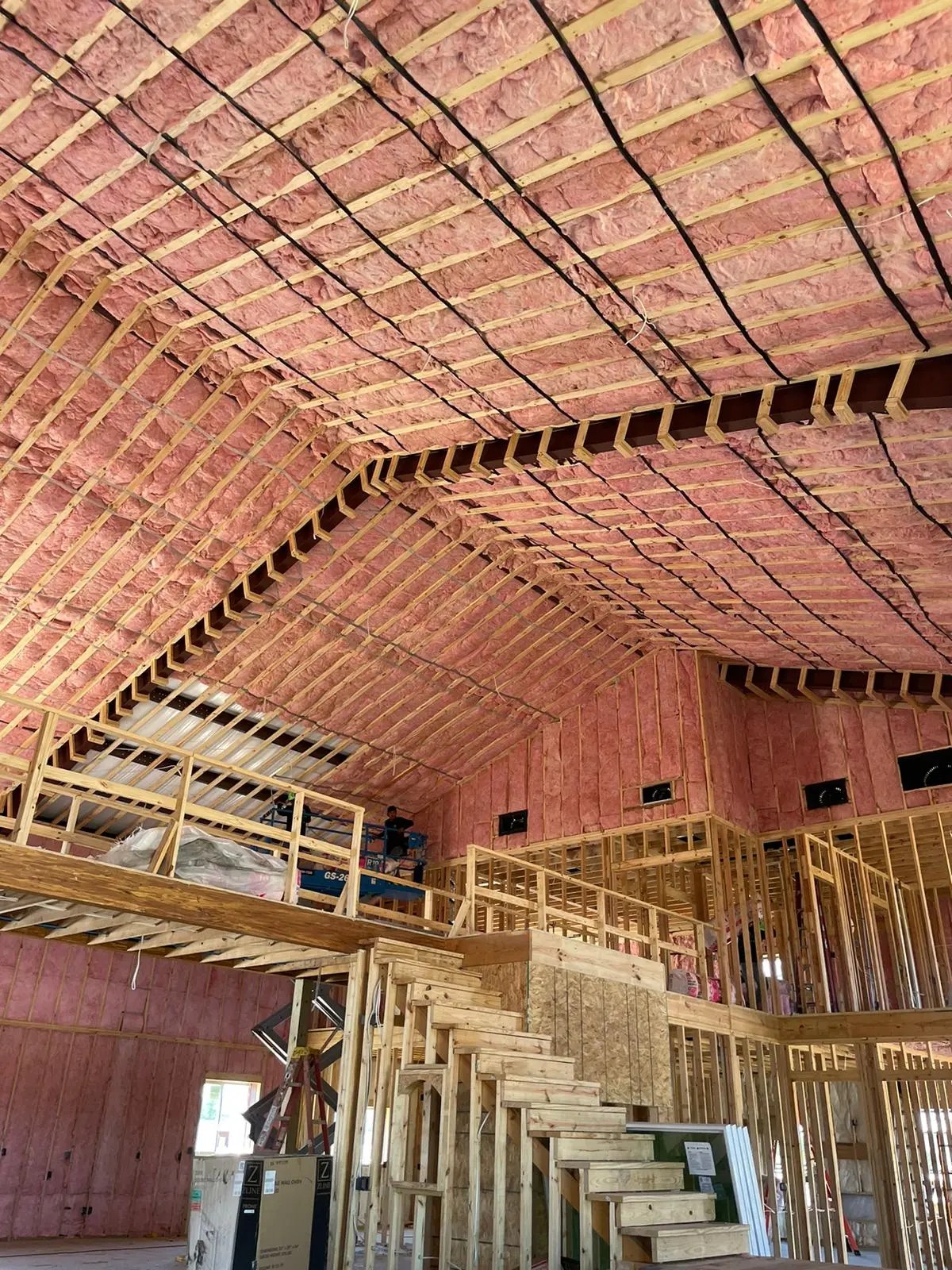EZ Attic technician removing old attic insulation