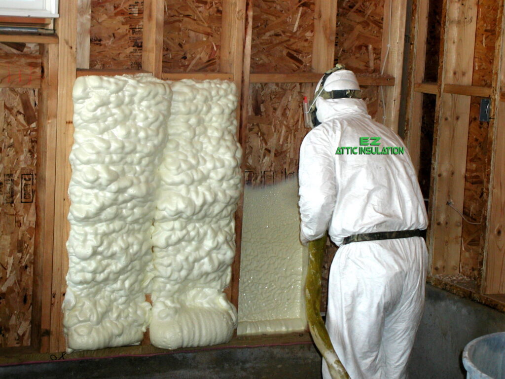 EZ Attic Insulation worker spray foaming insulating a home