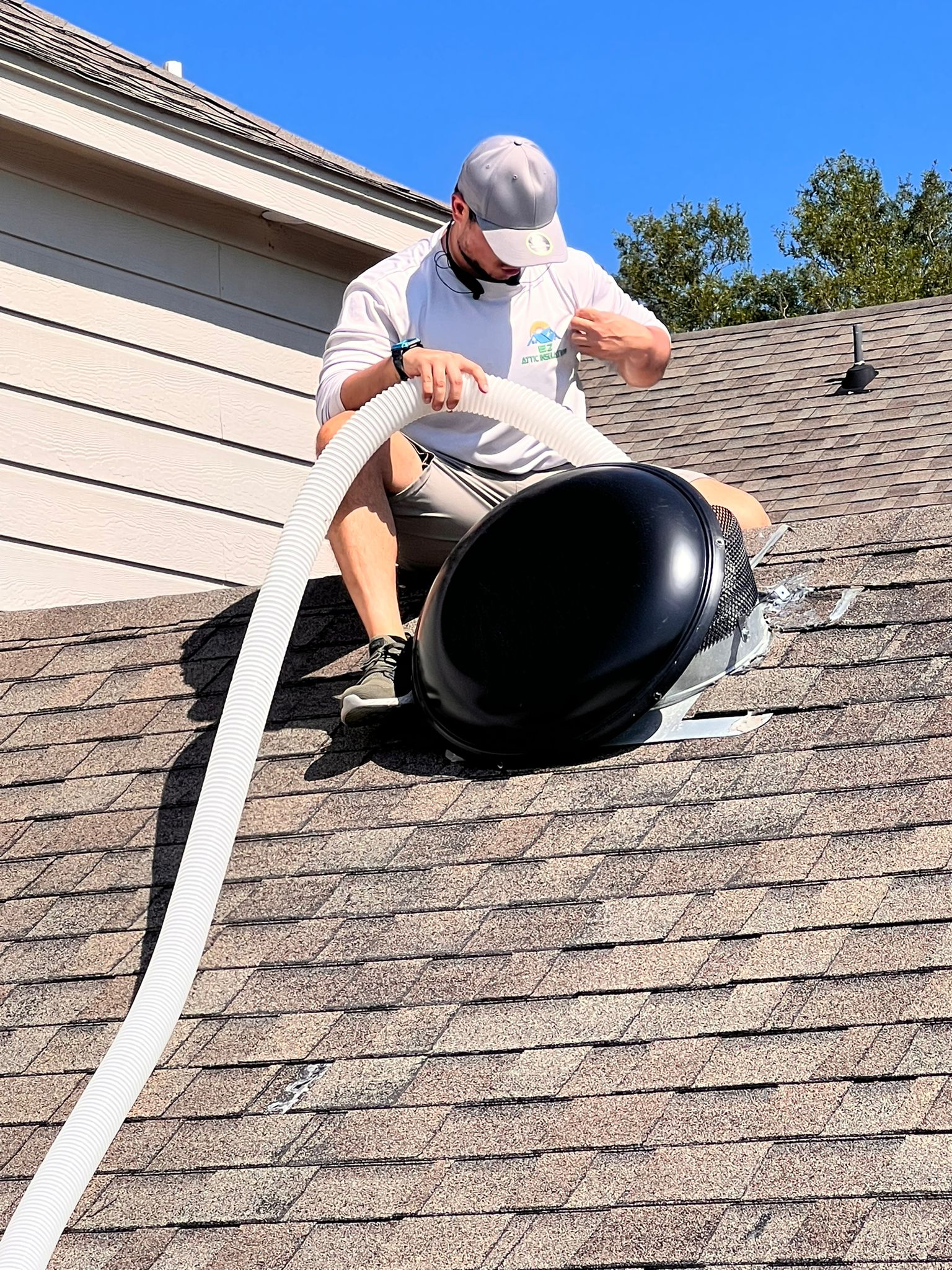 EZ Attic worker cleaning an air vent
