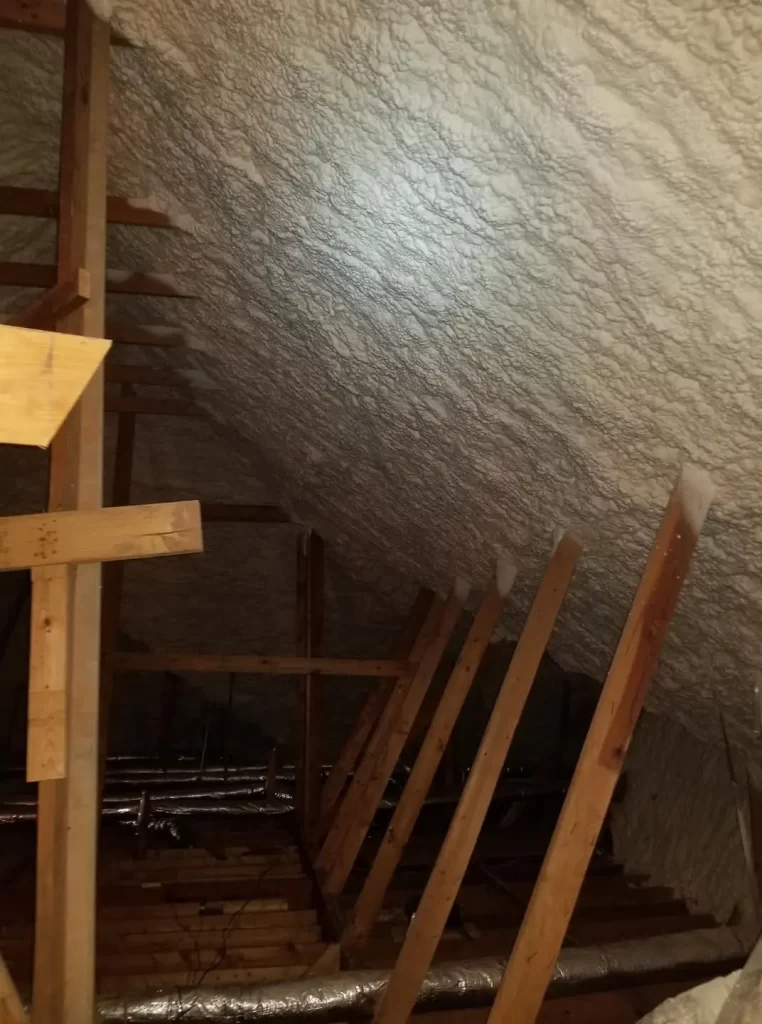 An attic insulated with spray foam.