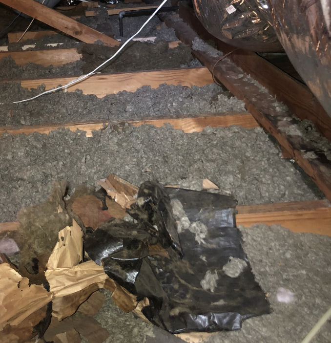 old insulation ready to be removed in a Houston home