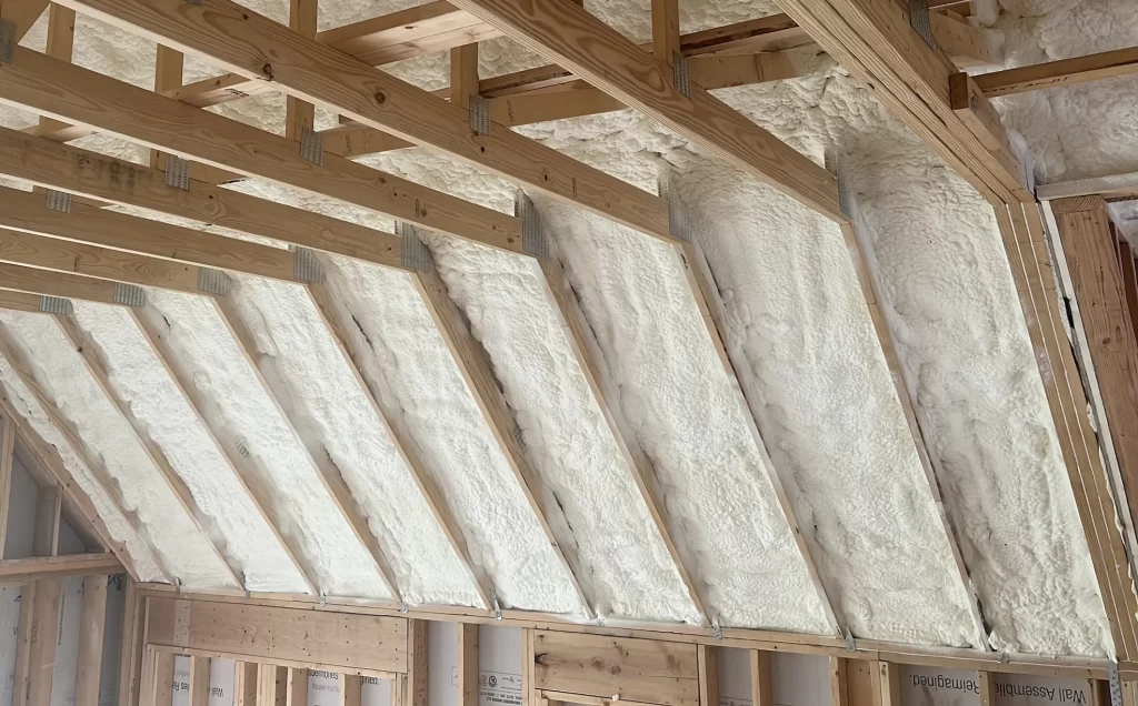 White Spray Foam Installed in an Attic to Insulate home from hot and cold temperatures.