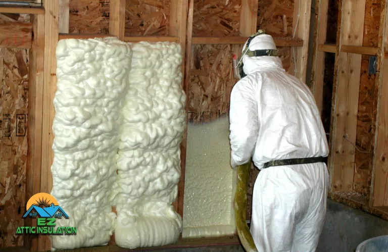 a EZ Attic Worker installing spray foam insulation in a new construction home