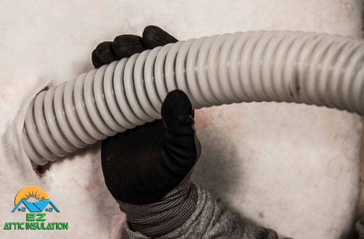 Installing wall insulation by feeding insulation pipe through hole created in wall.
