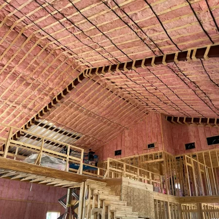 new fiberglass batt insulation in a large building